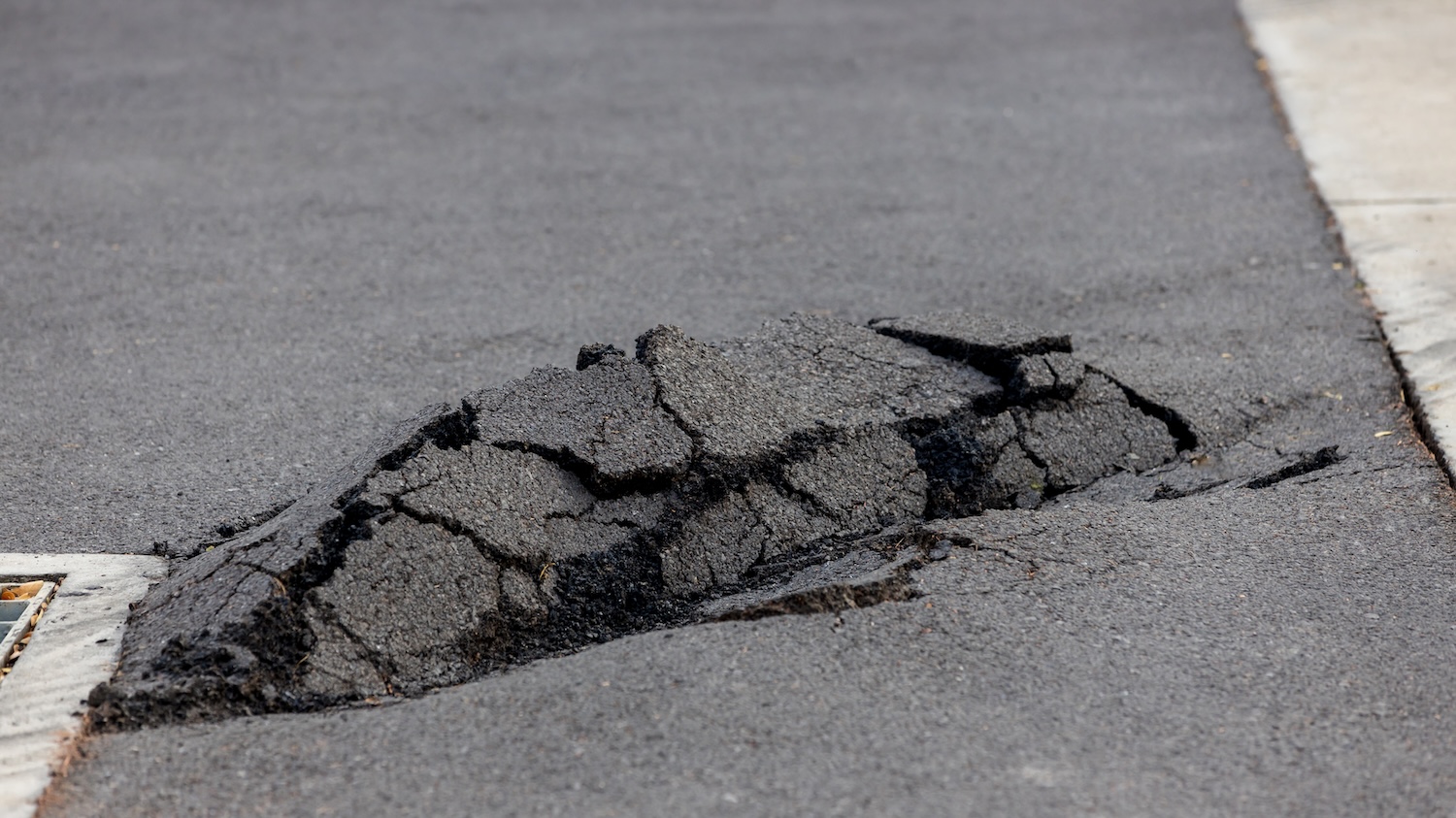 damaged asphalt in need of repair damaged asphalt in need of repair